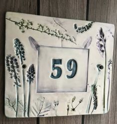 a plaque with the number 59 painted on it