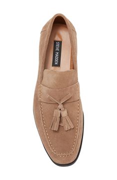 Swingy tassels accent the vamp of this smooth suede loafer that'll bring a timeless, yet stylish approach to your look. Leather upper/synthetic lining/rubber sole Imported Casual Suede Tassel Loafers, Classic Leather Tassel Loafers With Fringe, Suede Tassel Slip-on Moccasins, Suede Tassel Loafers For Work, Suede Tassel Loafers With Brogue Detailing For Work, Spring Formal Suede Tassel Loafers, Formal Suede Tassel Loafers For Spring, Formal Spring Suede Tassel Loafers, Fall Suede Slip-on Tassel Loafers