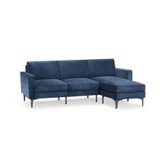 a blue sectional sofa with two chaise lounges on top and one end facing the couch