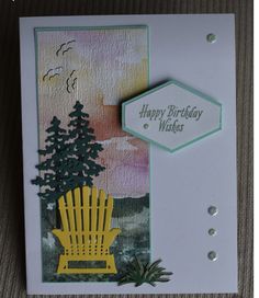 a birthday card with a yellow chair and pine trees on the front, which reads happy birthday wishes