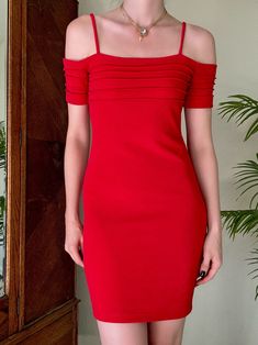 "Vintage Y2K Hugo Buscati Off the Shoulder Dress//This was a brand sold at Victorias Secret. Sultry crimson red stretch fabric with pin tuck detailing at the bust and sleeves. The most gorgeous and flirty piece, highly glamorous! Would be the perfect holiday dress. In amazing condition! Size XS, but please compare your measurements and ask me questions. Made in the USA. Price firm Bust: 31\" Waist: 27.5\" Hip: 35-37\" Length: 33.5\" We ship internationally!" Chic Red Elastane Midi Dress, Elegant Red Elastane Bodycon Dress, Elegant Red Bodycon Dress With Elastane, Red Fitted Elastane Dress, Fitted Red Elastane Dress, Formal Red Ruched Bodycon Dress, Fitted Off-shoulder Pleated Midi Dress, Fitted Red Pleated Midi Dress, Red Pleated Mini Dress For Evening