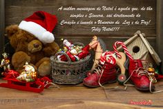 a teddy bear sitting next to a basket filled with christmas decorations and candy canes