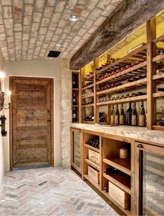 a wine cellar with wooden shelves filled with bottles