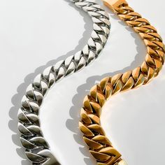 Make a statement with our bold Icon Chain Necklace, available in striking silver and luxurious gold finishes. Crafted from durable stainless steel, this necklace exudes confidence and style. The chunky chain design adds an edgy flair to any outfit, whether you're dressing up for a night out or adding some attitude to your everyday look. Reflect your unique personality and elevate your jewelry game. Stand out from the crowd with our Icon Chain Necklace and unleash your inner icon. Silver or 18k G Modern Bracelets With Chunky Cuban Link Chain, Modern Chunky Chain Cuban Link Bracelets, Modern Chunky Cuban Link Chain Bracelet, Modern Cuban Link Bracelet With Chunky Chain, Modern Chunky Cuban Link Bracelet, Modern Chunky Chain Cuban Link Bracelet, Modern Silver Cuban Link Bracelet With Chunky Chain, Luxury Cuban Link Bracelet With Chunky Chain, Trendy Gold Necklace For Streetwear