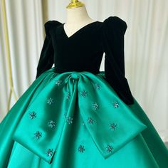 Elevate your little princess's style with the Dreamy Vow Luxury Arabic Green Girl Dress. Adorned with crystals and a V-neck, this dress exudes elegance and sophistication. Perfect for holidays, birthdays, weddings, and parties, it will make her feel like a true royal. Don't miss out on this stunning ball gown. Elegant Green Pageant Dress For Dress-up, Elegant Green Ball Gown For Pageant, Elegant Long Sleeve Ball Gown For Dress-up, Elegant Green Pageant Dress, Elegant Holiday Gown For Pageant, Elegant Holiday Pageant Gown, Elegant Holiday Gown For Pageants, Elegant Green Gown For Dress-up Events, Elegant Fitted Holiday Dress For Pageant