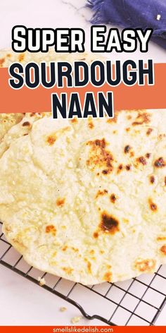 a close up of food on a rack with text overlay that reads super easy sourdough naan