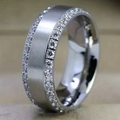 a wedding ring with diamonds on it