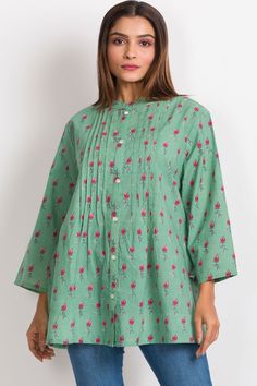 Our Amisha Cotton Tunic is a popular new addition to our sustainable apparel collection. Made with printed 100% cotton fabric, this fair trade tunic features a button down front and roll up button sleeves. These soft cotton tunic tops are free size, and are designed for an elegant, comfortable fit up to size XXL. One size fits most. Green Floral Print Long Sleeve Kurta, Spring Straight Kurta Blouse With Printed Motifs, Green Tunic Kurta For Spring, Spring Green Tunic Kurta, Green Spring Tunic Kurta, Green Printed Blouse For Daywear, Cotton Tunic With Relaxed Fit For Daywear, Green Long Sleeve Tunic With Printed Motifs, Relaxed Fit Cotton Tunic For Daywear