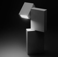 a black and white photo of a light fixture in the shape of a rectangle