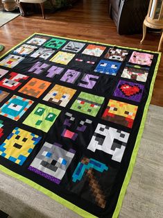 a quilt made to look like an old video game character is displayed on the floor