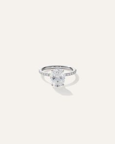 a white diamond ring on a white background