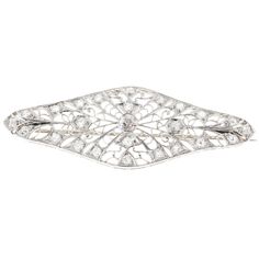 Circa 1900’s Edwardian Art Deco Platinum open work diamond filigree brooch. 1 old mine cut diamond approx. total weight .20cts, G, VS 22 old mine cut diamonds approx. total weight .28cts, G, VS Platinum Tested: Platinum 6.4 grams 2 x ¾ inch Antique Oval Diamond Brooch, Ornate Diamond Brooch For Anniversary, Ornate Diamond Brooches For Anniversary, Diamond Filigree Brooches As Gift, Ornate Diamond Brooch With Intricate Design, Ornate Diamond Brooches With Intricate Design, Classic Rose Cut Diamond Brooches, Classic Brooches With Rose Cut Diamonds, Victorian Diamond Filigree Brooches