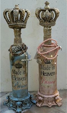 two vases with pearls on them sitting next to each other