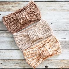 three crocheted bow ties laying on top of each other next to one another