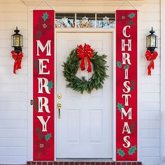 christmas decorations on the front door of a house with wreaths and lights hanging from it