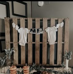 a baby shower with cake and bundts on the table in front of it