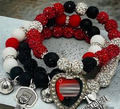 Beautiful black, red and white 10mm rhinestone coated clay beads with a metal charm. All black option with 10mm matte black beads and metal charm. Please note that designs may be slightly different depending on size. Sizes sent will be women's sizes. Please personal message me if Men's size needed. Black Rhinestone Bracelets For Gifts, Black Rhinestone Bracelets As Gift, Bracelets For Prom, Candy Bracelets, Arm Candy Bracelets, Diy Keychains, Football Bracelet, Beaded Bangles, Georgia Football