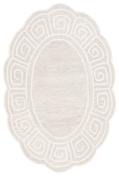 a white rug with an oval design on it