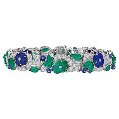 Bursting with joyful flowers, this Art Deco Charlton New York sapphire, diamond, lapis, and chalcedony bracelet is an everlasting garden party. With carved sapphire beads, electric blue lapis and fresh green chalcedony flowers in full bloom, this rare and collectible bracelet is as beautiful as the first day of Spring. Circa 1920-35. Signed Charlton. 7" by 1/2 in width. Chalcedony Bracelet, Sapphire Beads, Platinum Bracelet, Retro Bracelet, Art Deco Bracelet, Gems Bracelet, Green Chalcedony, New York Art, Sapphire Diamond