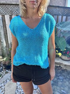 Hand knitted turquoise top Light Blue Knit V-neck Top, V-neck Textured Knit Beach Sweater, Blue Stretch Fine Knit Top, Blue Open Knit V-neck Sweater, Blue Short Sleeve Knit Top, Beach V-neck Stretch Knit Top, Blue Knitted Crew Neck Top, Vacation Tops With Knit Fabrication And Stretch, Summer Light Blue Knit Top With Crew Neck