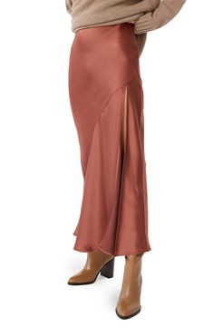 An asymmetric seam trails down the front of this lustrous satin skirt cut to a floor-grazing length. 38 1/2" center front length (size Medium) Unlined 53% viscose, 47% rayon Dry clean Imported Hard Launch, Sew Ideas, Olive Top, Satin Maxi Skirt, Satin Maxi, Satin Skirt, Silk Skirt, Photography Session, Manhattan