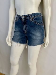 "Vintage Women's 90's Levi's 517, High Waisted, Cut Off's, Denim, Shorts (S) 669 These Ladies Shorts come in a medium blue colored wash cotton and have three front pockets, two back pockets and are high waisted with belt loops, front button closure with signature Levi's red tab logo and fringe front. 100% Cotton Made in Guatemala *These shorts are in excellent condition. Size: (S) Modern Day 4 (Tag Size: 5 jr M) Waist: 30\" Length: 12 1/2\" (unfolded) Hips: 34\" Rise: 10\" (front) 13\" (back) In Instagram Rates, Levis 517, Ladies Shorts, Geometric Top, High Waisted Shorts, Medium Blue, Guatemala, Cut Off, Clothing Items