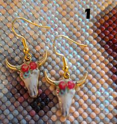 Super cute bull/cow skull earrings, gold tone metal alloy with enameled design, choose from four styles! Very lightweight, we have hung them on gold-tone wires. They will arrive packed in a fabric storage bag Bull Cow, Cow Skull, Skull Earrings, Enamel Earrings, Fabric Storage, Gold Tone Metal, Ear Piercings, Bag Storage, Cow