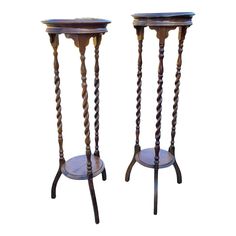 two wooden candlesticks sitting on top of each other