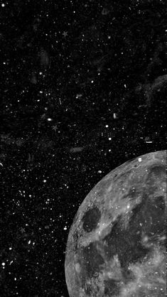 a black and white photo of the moon with stars in the night sky above it