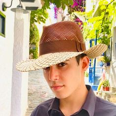 Authentic panama fedora made in natural straw in brown and beige colors. Finished with a quality brown grosgrain ribbon of 4 centimeters wide.Beautiful summer hat for men and woman.The measurements in centimeters are 36 x 34. Brim length 9.5. (These measurements may vary slightly depending on the size of the hat)For its elaboration we only use hoods and capelines of resistant natural straw  (genuine paja toquilla) of very good quality.In our workshop in the Pyrenees we sew and make one by one ou Brown Visor Straw Hat For Outdoor, Classic Travel Hats With Uv Protection, Brown Toquilla Straw Panama Hat For Outdoor, Curved Brim Panama Hat With Uv Protection For Travel, Brown Outdoor Visor Straw Hat, Brown Straw Hat With Uv Protection For Travel, Uv Protection Panama Hat With Curved Brim For Travel, Summer Visor Panama Hat For Travel, Summer Panama Visor Hat For Travel