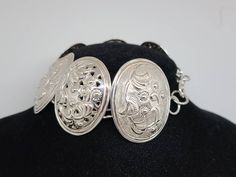 925 Silver Embossed Floral Oval link Panel Bracelet Item w# 1263 Clean and in good condition 7.5 to 7.75 inch fit Adjustable Oval Engraved Bracelets, Engraved Adjustable Oval Bracelets, Sterling Silver Formal Bracelet With Intricate Design, Formal Sterling Silver Bracelet With Intricate Design, Traditional Sterling Silver Bracelet For Formal Occasions, Sterling Silver Oval Bracelet, Ornate Oval Engraved Bracelets, Oval Engraved Bracelets For Gifts, Engraved Oval Bracelets