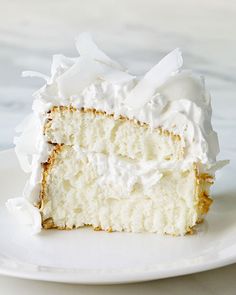 a piece of cake with white frosting on a plate