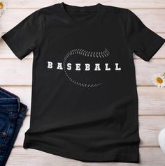 Baseball shirt. Baseball lovers shirt. Sports lovers shirt. Baseball fans shirt. Baseball player shirt. Baseball supporters shirt. Baseball shirt for men. Baseball shirt for women. Baseball dad shirt.  Baseball cool design. Suitable outfit for women, men, girls, boys, baseball lovers, baseball player on holiday, birthday.  🌟 Welcome to SOUQUSA4U! We're excited to bring you premium, ethically crafted cotton T-shirts designed for both comfort and style. Every shirt is made with care and attention to detail, tailored just for you. 📏 PRODUCT INFORMATION & SIZING: Please refer to the Size chart in the images above to find your perfect fit. 🛒 HOW TO PLACE YOUR ORDER: Choose your preferred T-shirt size and color. Select the quantity you want. Click "Add to Cart." For multiple items, simply ret Screen Print Sports Fan T-shirt, Sporty Short Sleeve T-shirt For Sports Season, Black T-shirt With Logo For Baseball Season, Black T-shirt With Football Season Text Print, Black T-shirt With Text Print For Football Season, Sporty T-shirt With Text Print For Sports Events, Sports T-shirt With Crew Neck, Cotton Moisture-wicking T-shirt For Baseball Season, Black T-shirt With Letter Print For Game Day