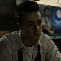 a man sitting at a table in a restaurant