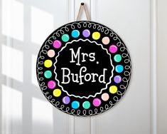 a door hanger with the words mr's buford painted on it