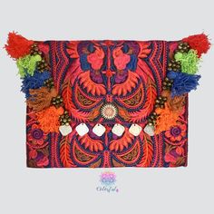 This Colorful Clutch is the ultimate boho-chic accessory. This gorgeous bohemian clutch bag is the perfect accessory to give a unique look to your casual outfits or night out events. Can be also used as an amazing iPad case. Handcrafted by talented artisans using a stunning fabric embroidered by the Hmong hill tribes in Northern Thailand. Details: Material: Embroidered cotton fabric with discreet birds design. Tassel and coins decoration. Magnetic closure with interior zipper pocket Cotton linni Pom Pom Clutch, Handbags For Girls, Colorful Clutch, Bohemian Clutch, Embroidered Clutch Bag, Boho Chic Accessories, Teaching Sewing, Birds Design, Embroidered Clutch