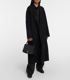 Malika Wool Blend Coat in Black - The Row | Mytheresa Black Evening Outerwear With Concealed Placket, Evening Long Wool Coat For Fall, Evening Wool Long Coat For Fall, Fall Evening Long Wool Coat, Elegant Oversized Long Wool Coat, Black Cashmere Wool Coat For Winter, Winter Black Cashmere Wool Coat, Classic Black Cashmere Wool Coat, Timeless Structured Evening Outerwear