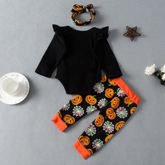 Baby Girls Halloween Pumpkin Print Long Sleeve Jumpsuit Two Piece Set - PrettyKid Fun Black Cotton Onesie, Black Long Sleeve Halloween Onesie, Halloween Costume Sets With Long Sleeves, Long Sleeve Halloween Costume Sets, Black Costume Sets For Halloween, Black Cotton Sets For Fall, Playful Black Sets With Character Print, Black Cotton Set With Cartoon Print, Black Long Sleeve Sets For Halloween