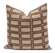 a brown and white pillow on a white background