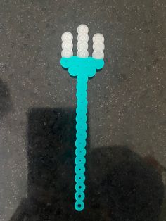 a blue toothbrush sitting on top of a counter