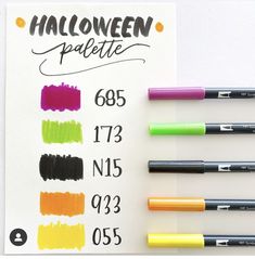 five different colored markers next to each other on a piece of paper with the words halloween palette written in it