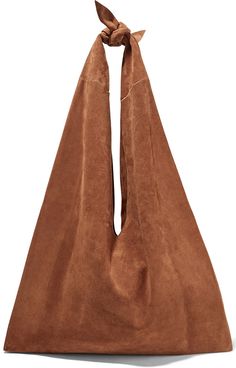 a brown sued bag with a bow on top