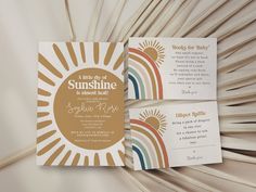 the wedding stationery was designed to match the theme of the sun and rainbows