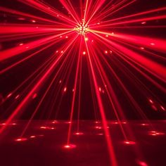 red laser lights shining in the dark