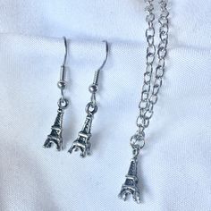 "One of our shop members made an earring and necklace out of these cute vintage style Eiffel Tower souvenir charms. Perfect for your favorite Parisienne (or Paris fan)!  These charms are petite so this is also a great gift for little ladies. Components: Eiffel Tower charms, wire hooks*, chain necklace  Dimensions: 18\" long necklace, charms are 5/8\" long Condition: New  These sets are available in bronze, silver and copper- all have an antiqued finish.  I'm happy to ship internationally- just m Vintage Hypoallergenic Jewelry For Gift, Hypoallergenic Vintage Jewelry For Gift, Silver Vintage Charm Earrings For Gift, Silver Earrings With Vintage Charm As Gift, Silver Earrings With Vintage Charm For Gift, Cute Nickel-free Metal Charm Necklace, Cute Nickel-free Metal Charm Necklaces, Cute Metal Charm Necklace Nickel Free, Vintage Earrings With Dangling Charms As Gift