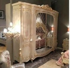 a bedroom with a bed, dresser and mirror in it's centerpieces