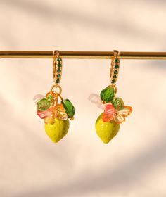 "♥AMALFI green lime hoop earrings, glass lemon drop earrings, food earrings, fruit earrings, healing summer earrings, custom earrings ♥ Cute AMALFI green lime hoop earrings are perfect to give that italian look to any outfit. The earrings are composed of a 24k gold plated hoop with little green zirconium, a glass lemon, butterfly and flower. DETAILS: ♥dimension: 1.2cm (0.47\") of the hoop, lenght 3.2cm (1.25\")  ♥material : stainless steel, 24k gold plated, glass ♥ style: boho chic Matching necklace and bracelet are possible on demand.  Other versions of this earrings are in the shop. I use high quality for my creations.  If you need any further information please feel free to contact me. Thank you for stopping in my shop.  ♥ ♥ ♥ ♥ ♥ ♥ ♥ ♥ ♥ ♥ ♥ ♥♥ ♥ ♥ ♥ ♥ ♥ ♥ ♥ ♥ ♥ ♥ ♥" Green Hoop Earrings As Summer Gift, Green Hoop Earrings For Gifts, Green Hoop Earrings For Summer, Green Fruit Design Earrings As Gift, Green Summer Jewelry With Fruit Design, Cute Green Jewelry With Fruit Design, Gift Green Earrings With Fruit Design, Green Hoop Earrings, Summer Gift, Green Fruit Design Earrings Gift