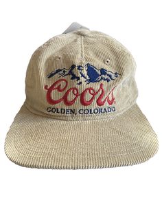 Show off your love for Coors Beer with this cool corduroy snapback hat from Mad Engine. This cap features the iconic Coors logo and is perfect for both casual wear and travel. The hat is made of lightweight and breathable cotton fabric, which makes it suitable for all seasons. The adjustable snapback design ensures a comfortable fit for all head sizes. This hat is perfect for those who love the outdoors and enjoy activities like fishing, camping, and beer drinking. Add this hat to your collectio Casual Corduroy Baseball Cap With Flat Brim, Vintage Corduroy Snapback Hat With Curved Brim, Outdoor Corduroy Snapback Baseball Cap, Corduroy Snapback Baseball Cap For Outdoor, Trendy Corduroy Snapback Baseball Cap, Vintage Corduroy Flat Brim Baseball Cap, Casual Corduroy 5-panel Baseball Cap, Casual Corduroy Hat With Flat Bill, Casual Corduroy Flat Bill Hat