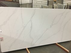 a large white marble slab in a warehouse