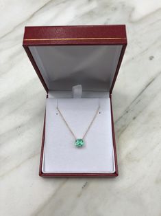 Featured here is a 1.32-carat stunning, Colombian emerald necklace in fine 14K yellow gold. Displayed in the center is a medium-light green emerald with incredible crystal clarity, accented by a simple four-prong gold mount, allowing for the emerald to be shown in full view. The earth mined, green Colombian emerald has a desirable lush green color with excellent qualities. An 18 inch is attached to the emerald pendant. This necklace is ideal for everyday use and is the perfect accessory to any o Green Diamond Necklace For Formal Occasions, Formal Green Hallmarked Diamond Necklace, Fine Jewelry Green Diamond Necklace For Anniversary, Formal Emerald Necklace With Diamond Cut, Formal Hallmarked Emerald Necklace, Formal Emerald Necklaces With Diamond Cut, Emerald Necklace In Brilliant Cut, Formal Gold Sterling Silver Emerald Necklace, Formal Emerald Pendant Necklace With Diamond Cut